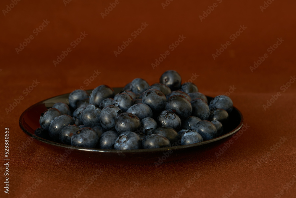 blueberries lie on a black background, harvest blueberries lie on a black background, harvest