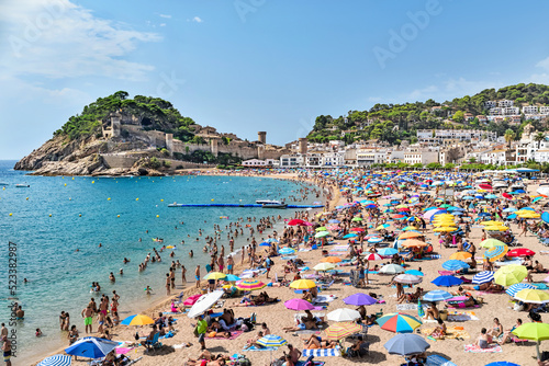 Fototapeta Naklejka Na Ścianę i Meble -  Catalunya,  Tossa de Mar, Spain: 08.14.2022; The summer beach in Tossa de mar