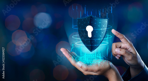 shield with key inside on blue background The concept of cybersecurity the Internet