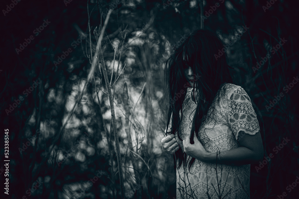 Portrait of asian woman make up ghost face at the swamp,Horror in water scene,Scary at river,Halloween poster,Thailand people Portrait of asian woman make up ghost face at the swamp,Horror in water scene,Scary at river,Halloween poster,Thailand people