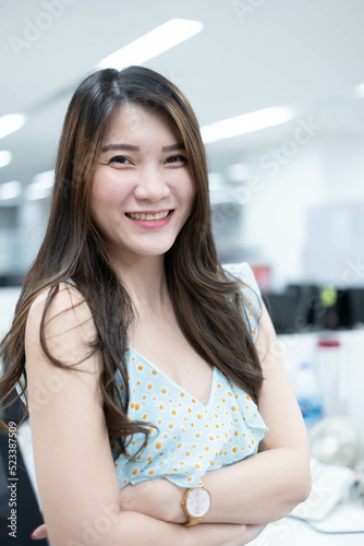 Successful businesswoman in Modern office. Confident woman wearing casual clothes. Portrait of young smiling asian woman. Happy girl in creative office. Happy asian Businesswoman Using Computer. Free Download Successful businesswoman in Modern office. Confident woman wearing casual clothes. Portrait of young smiling asian woman. Happy girl in creative office. Happy asian Businesswoman Using Computer. - GFXLoad