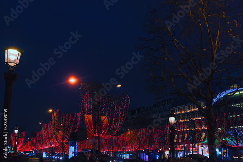 Parisian street in Christmas Night . Paris New Year illumination . Champs Elysees in nighttime