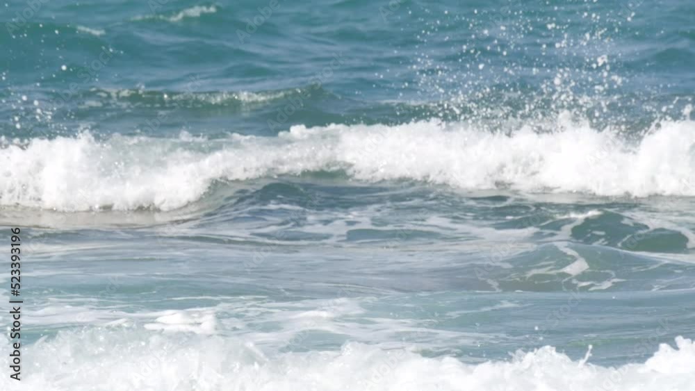 Storm on the sea. Beautiful strong big waves with foam during a summer storm on the Cretan Sea Storm on the sea. Beautiful strong big waves with foam during a summer storm on the Cretan Sea