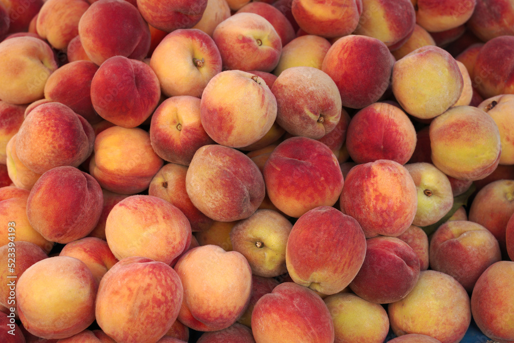 Ripe peaches at the market. Background. Harvest.Food texture. Ripe peaches at the market. Background. Harvest.Food texture.