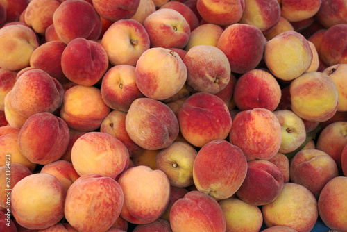 Ripe peaches at the market. Background. Harvest.Food texture.