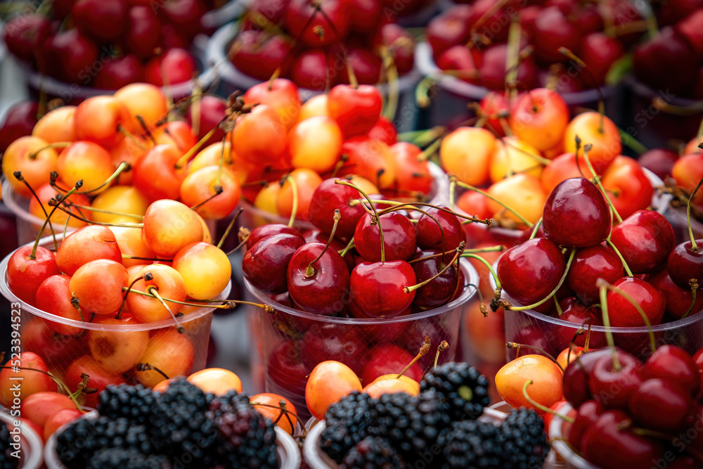 Mix berries includes red cherry, white cherry and black berries in season street market Mix berries includes red cherry, white cherry and black berries in season street market