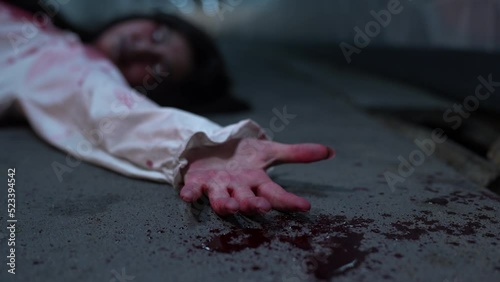 Bloody Hands of woman or murder crime killer on dirty floor or Zombie or ghost horror in the dark background nightmare screaming on hell is monster girl or female dead characters at night.