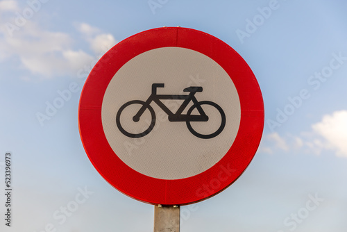 No bicycle street sign with bue sky, bike prohibited symbol. Sign indicating the prohibition or rule. Warning and forbidden