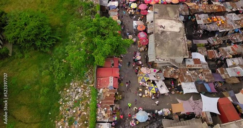 Aerial Forward Tilt Up Shot Of Crowded Market In Residential City - Port-au-Prince, Haiti