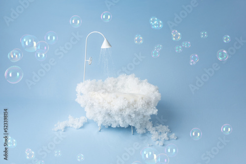 children's holiday decoration of the photo zone. small baby bath with foam. background texture the first photo session of a newborn