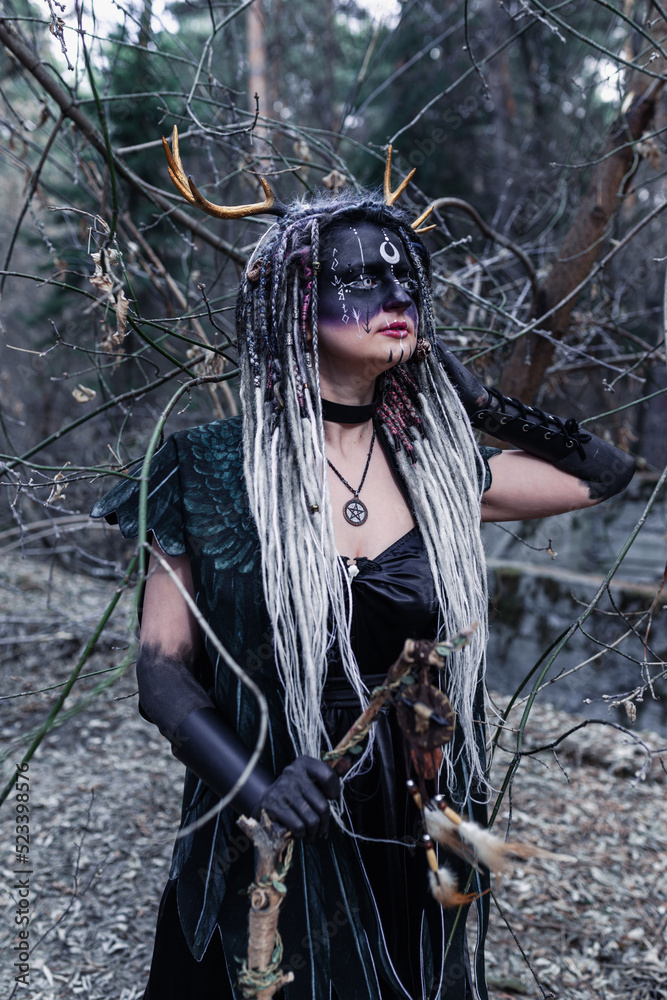 Naklejka premium Forest witch in a pine forest