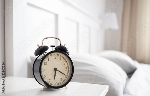 vintage alarm clock in bright bedroom