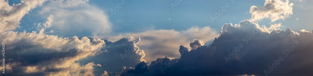 Sky panorama. Beautiful dramatic big clouds in the sky. Landscape of the power of heaven and nature. Copy space