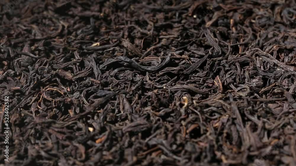 Dried black tea leaves close up. Macro. view on turntable Dried black tea leaves close up. Macro. view on turntable