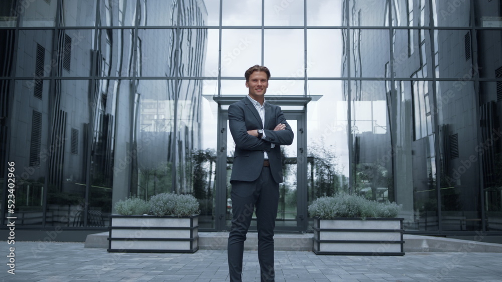 Smiling financial consultant standing at modern office portrait. Success concept Smiling financial consultant standing at modern office portrait. Success concept