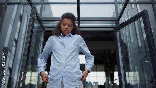 Wallpaper Mural Stressed office worker looking down feeling bored contemporary office building. Torontodigital.ca