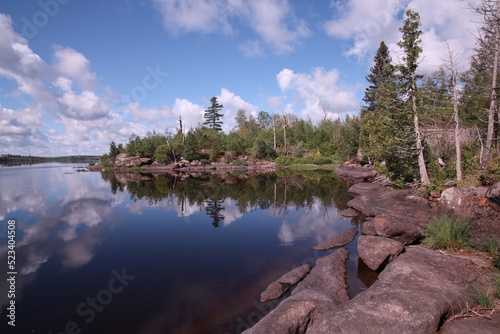 reflection of trees in Isabella lake in the Boundary Waters Canoe area Minnisota photo