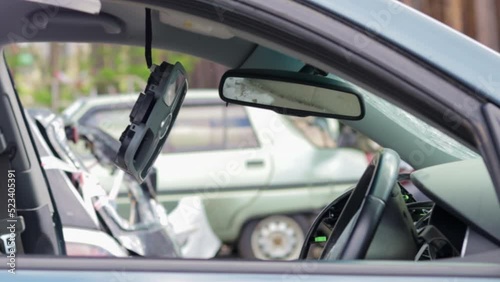 Criminal incident. Breaking into a car parked on the street. Broken side glass. A crime committed by a thief, stealing things. Damaged car window after an accident.