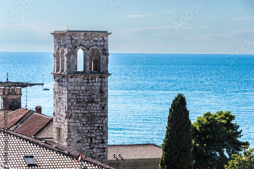 view to an old tower at the sea in porec, croatia