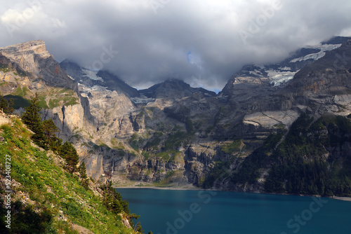 Panoramic summer view of the Oeschinensee (Oeschinen lake) and the alps on the other side near Kandersteg, Berner Oberland, Switzerland, Europe