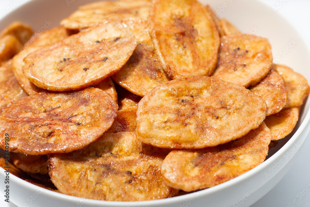 Banana chips on white background Banana chips on white background