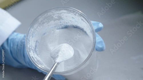 White powder in cup for scientific experiment. Top down view.