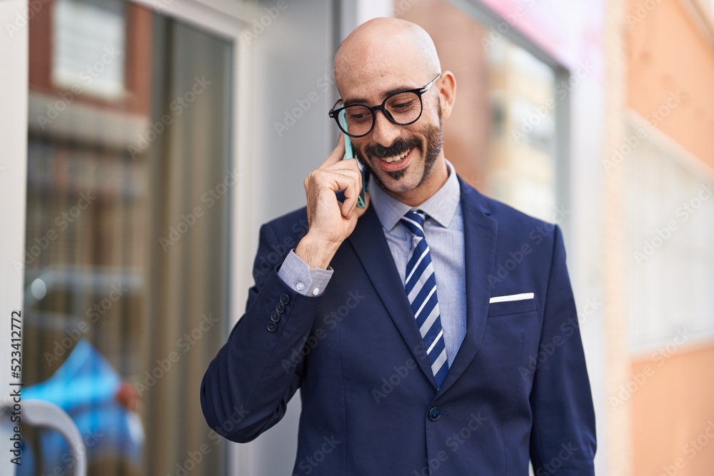 Young hispanic man executive smiling confident talking on smartphone at street Young hispanic man executive smiling confident talking on smartphone at street