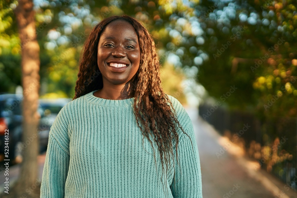 Young african woman smiling happy at the park Young african woman smiling happy at the park