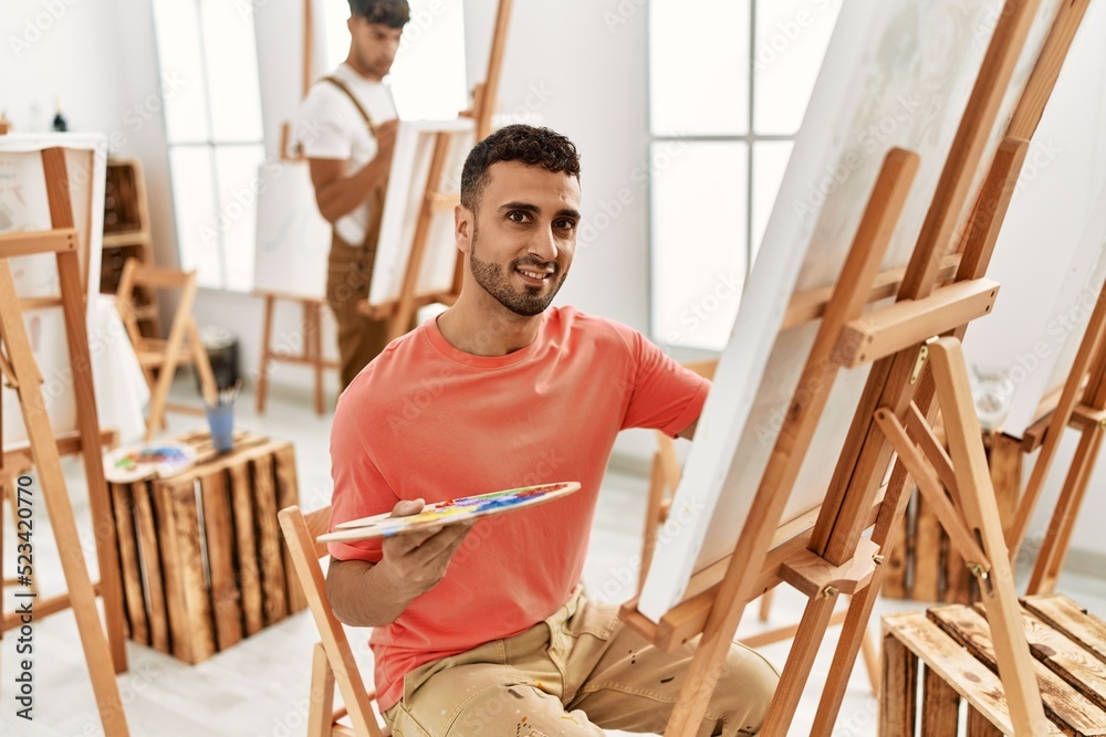 Two hispanic men couple smiling confident drawing at art studio Two hispanic men couple smiling confident drawing at art studio