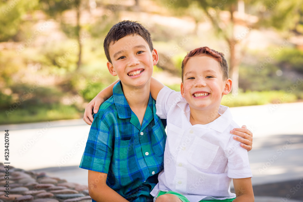 Outdoor portrait of mixed race Chinese and Caucasian brothers. Outdoor portrait of mixed race Chinese and Caucasian brothers.