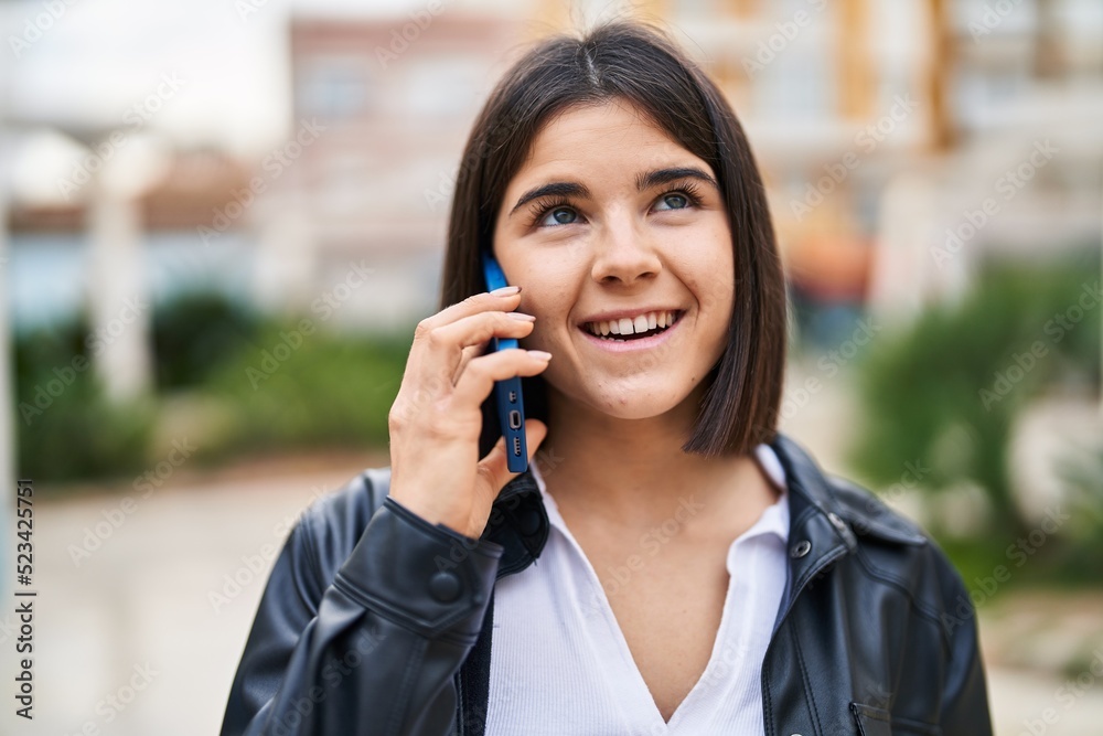 Young beautiful hispanic woman smiling confident talking on the smartphone at park Young beautiful hispanic woman smiling confident talking on the smartphone at park