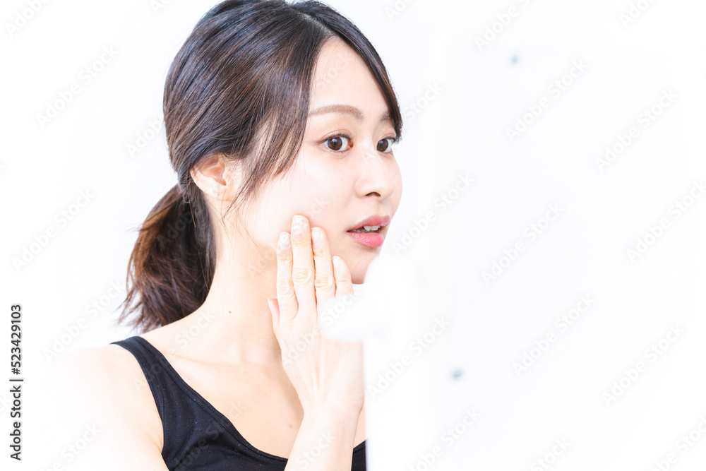 Young woman taking care of her skin Young woman taking care of her skin