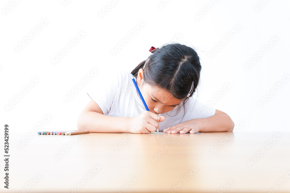 An elementary school girl studying by herself An elementary school girl studying by herself