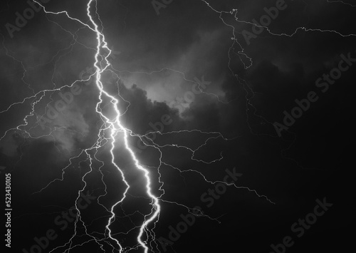 Fork lightning striking down during summer storm