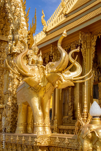 The statue of Erawan carries God Indra  in Wat Pak Nam Jolo in Chachoengsao Thailand, the only and wholly golden chapel in Thailand and was a monastery dated back to the end of Ayutthaya period.  photo