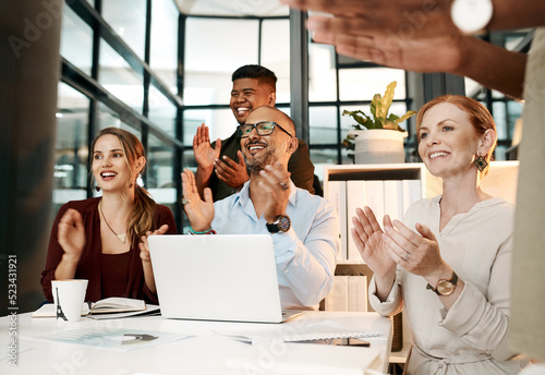 Professional team clapping hands, cheering during deal or meeting in modern office. Diverse group motivated by a plan, goal or strategy. Coworkers with a vision excited after planning a mission