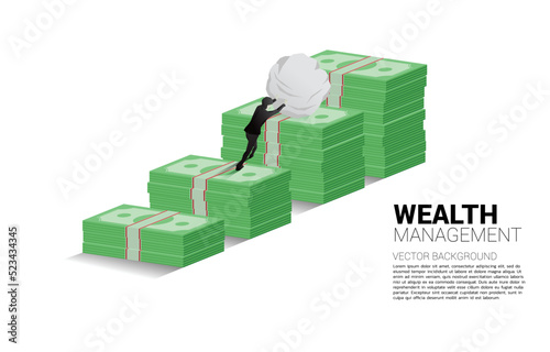Silhouette of businessman pushing the rock on growth graph with stack of banknote. Concept of success investment and growth in business