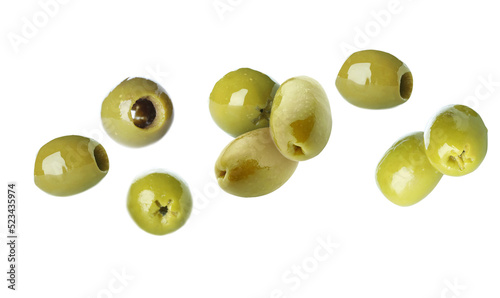 Flying green olives on white background