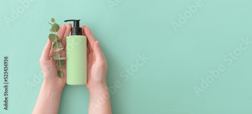 Female hands holding bottle...