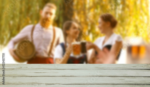 Empty wooden table and happ...