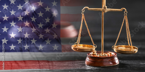 Double exposure of USA flag and scales of justice photo