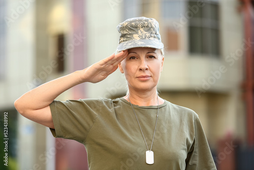 Mature female soldier salut...