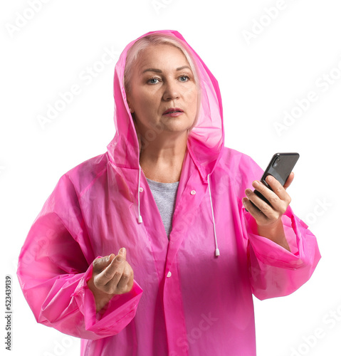 Mature woman in raincoat wi...