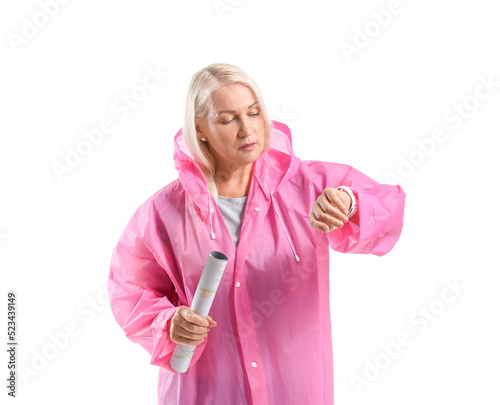 Mature woman in raincoat wi...