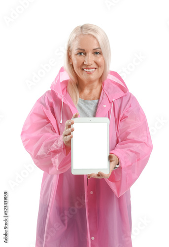 Mature woman in raincoat wi...