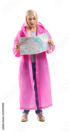 Mature woman in raincoat wi...