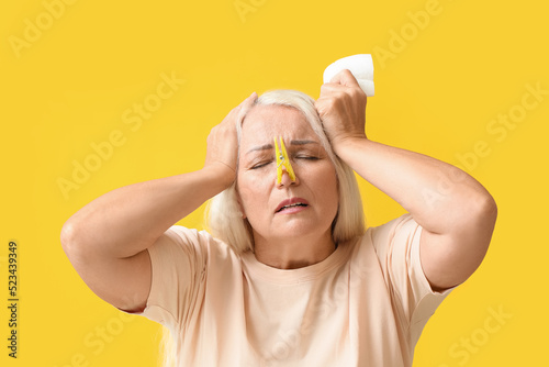 Ill mature woman with cloth...