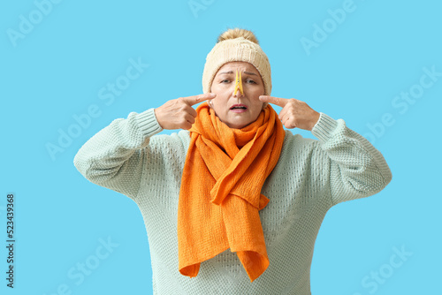 Ill mature woman pointing a...