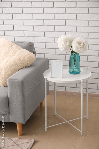 Blank photo frame and vase ...