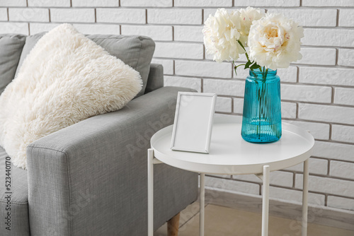 Blank photo frame and vase ...